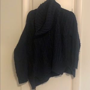 Navy blue cowl-neck sweater.